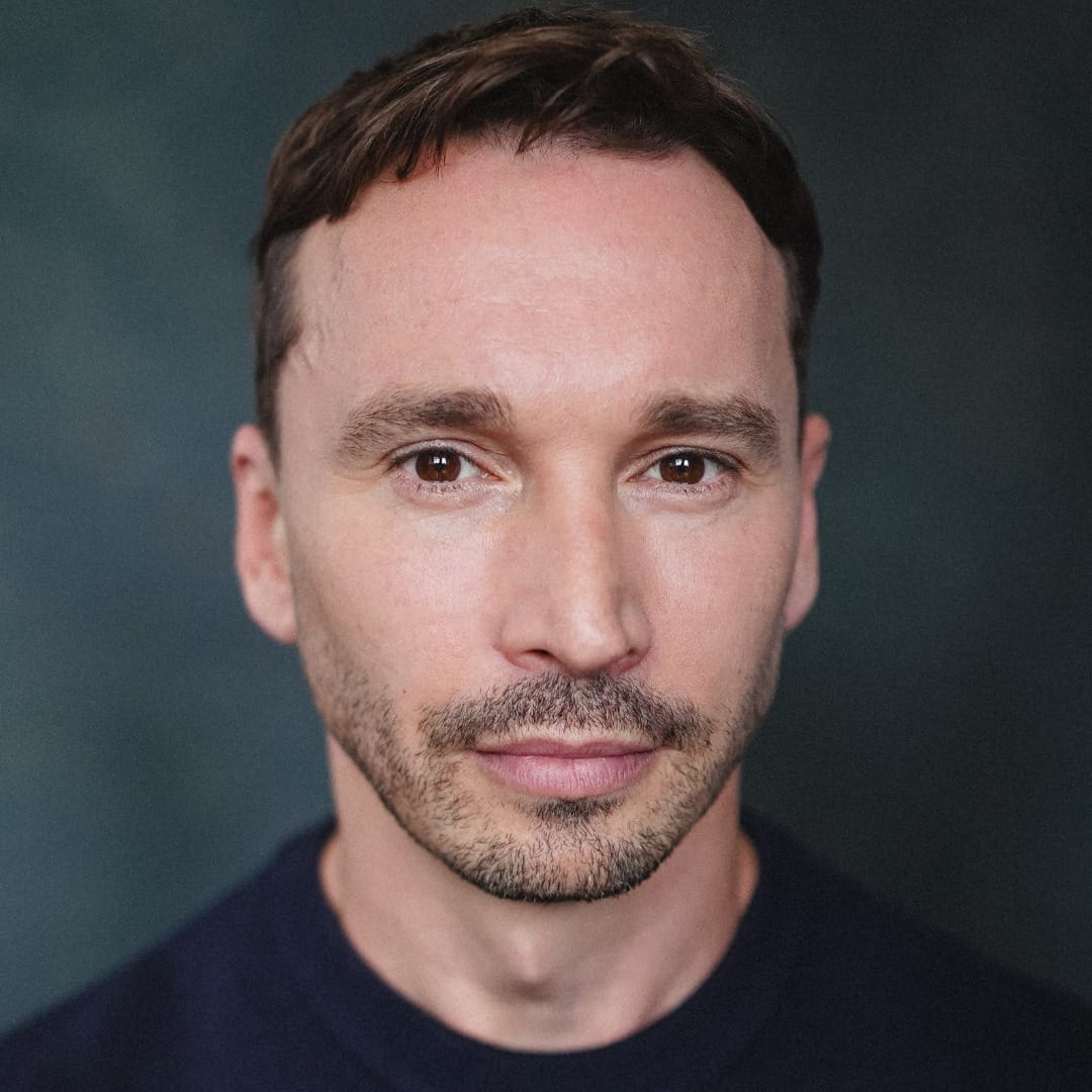 A headshot of actor Mark Jackson.